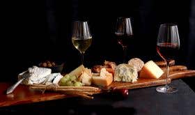 cheese board alongside glasses of different styles of sherry