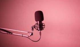 A microphone against a red background
