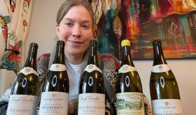 Samantha Cole-Johnson with 5 bottles of Burgundian Chardonnay