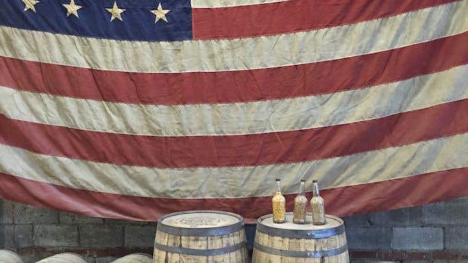 US flag and Tennessee whiskey barrels