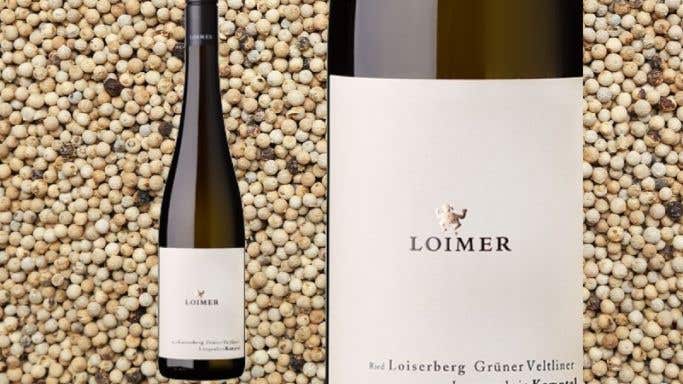 Loimer Loisenberg Grune Veltliner bottle against a background of white peppercorns