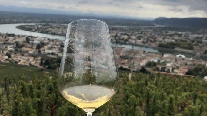 Glass of white Hermitage overlooking Tain l'Hermitage