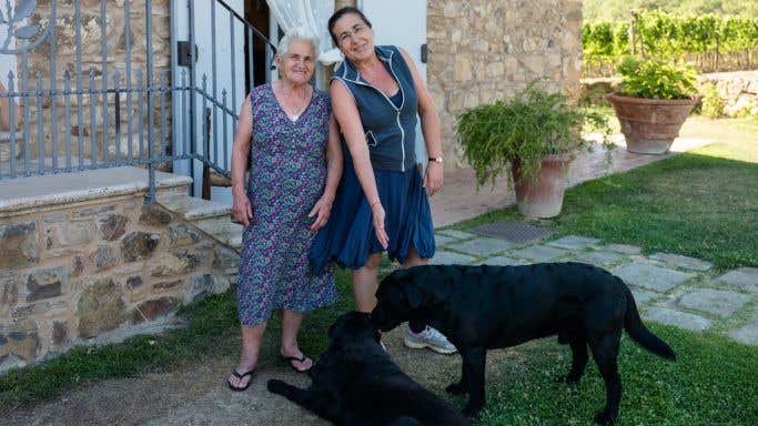 Laura Brunelli of Montalcino and her dog Orso, each with their mother