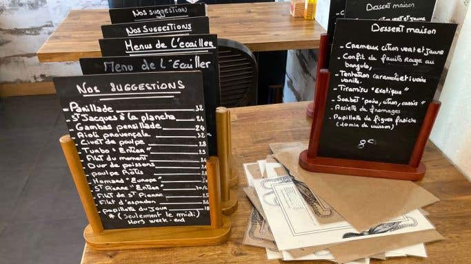 Restaurant menus written on mini blackboards
