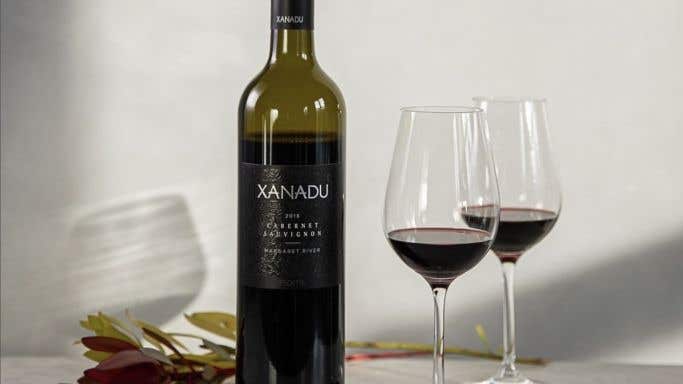 Bottle of Xanadu Cabernet with two glasses