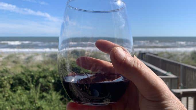 Glass of wine with sea in the background