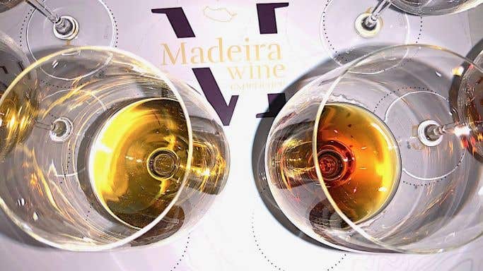 Madeira wine in glasses on tasting mat