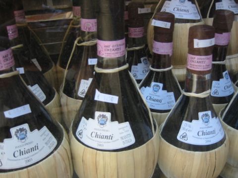 Multiple straw-covered fiaschi filled with Chianti wine