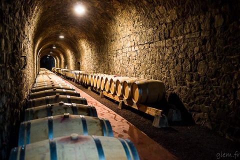 The barrel-filled tunnel of Domaine du Tunnel