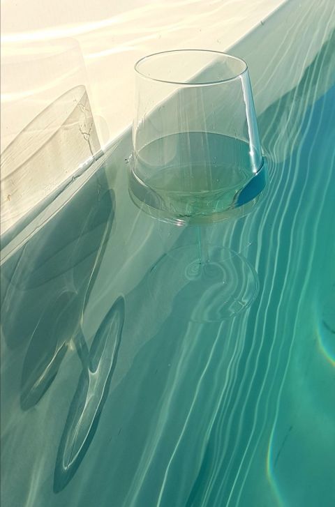 Pool at Baglio Occhipinti with wine glass, SE Sicily