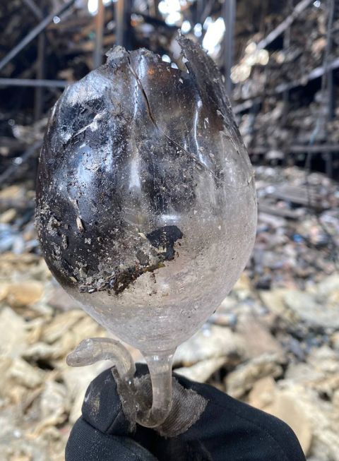 Destruction of Kyiv warehouse 2 of 3 showing melted wine glass