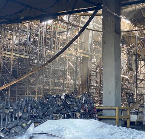 Destruction of Kyiv warehouse 3 of 3 showing piles of charred wine bottles