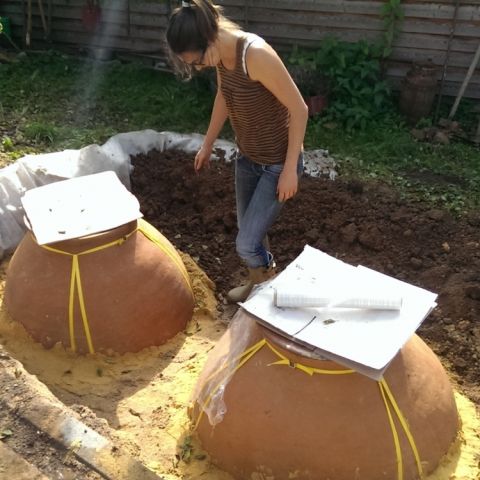 Corinne Kox installing her two Georgian kvevri