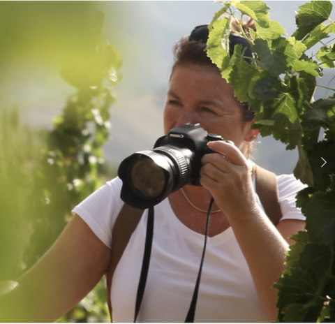 Elizabeth Hecker behind her camera