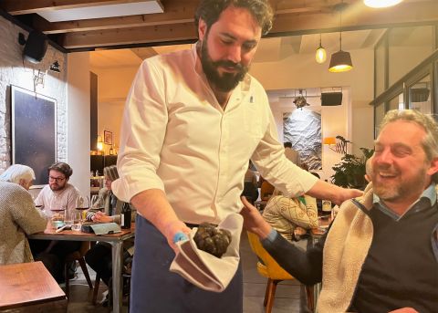Francesco Cury shows off a large truffle table side at Racines, Brussels 