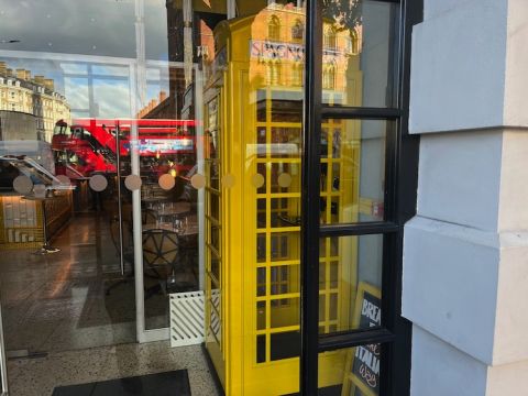 Magenta's yellow telephone kiosk
