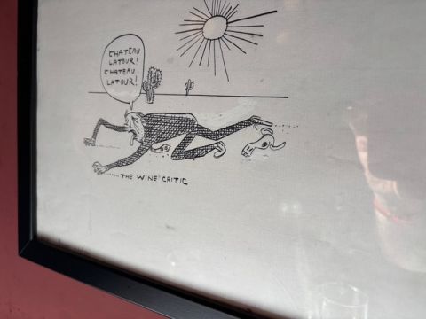 Wine critic cartoon on the wall at The French House