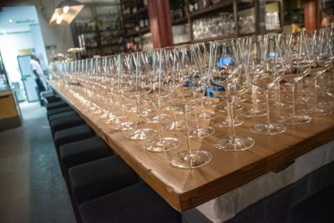 Hundreds of Jancis Robinson glasses on a table