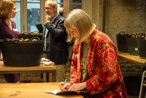 Jancis Robinson checking a booklet