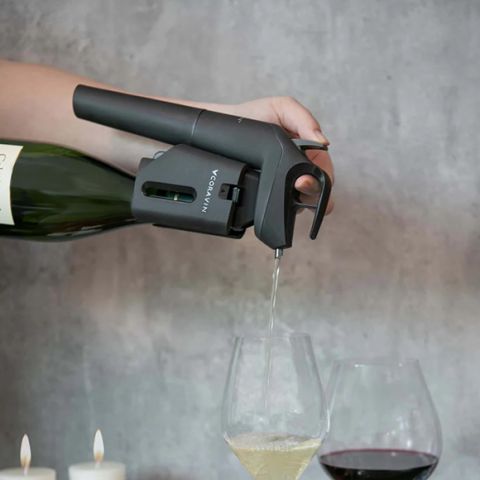 The Coravin in action, dispensing a white wine into a glass