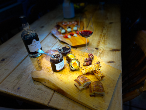 Pigs in blankets, cheese and onion pastries, Scotch egg, feta and honey filo cigars