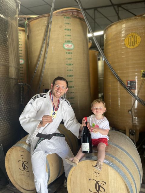 Loïc Ferraud i judo kimono in winery with daughter Juliette 