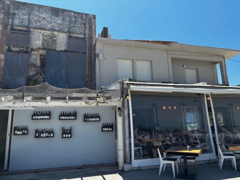 Salis exterior with ruin and old bottles