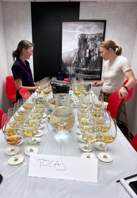 Tara Thomas and Sam Cole-Johnson setting up for a Tokaji tasting at the Volcanic Wine Awards 2026
