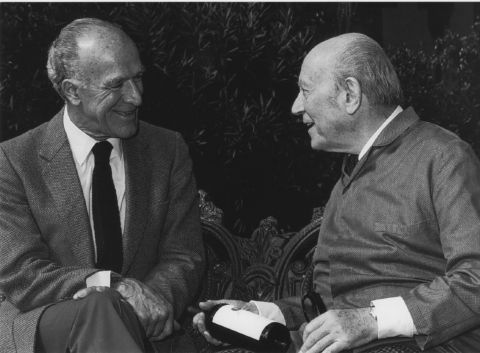 Robert Mondavi and Baron Philippe de Rothschild with bottle of Opus One