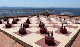 Emporda bottles on chessboard, Almadraba