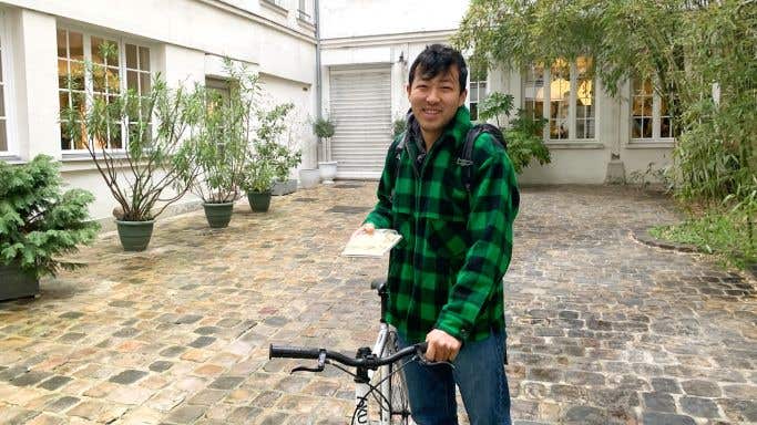 Dumpling maker in Paris on his bike